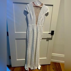 Gorgeous white sequin floor length gown with deep plunging neckline